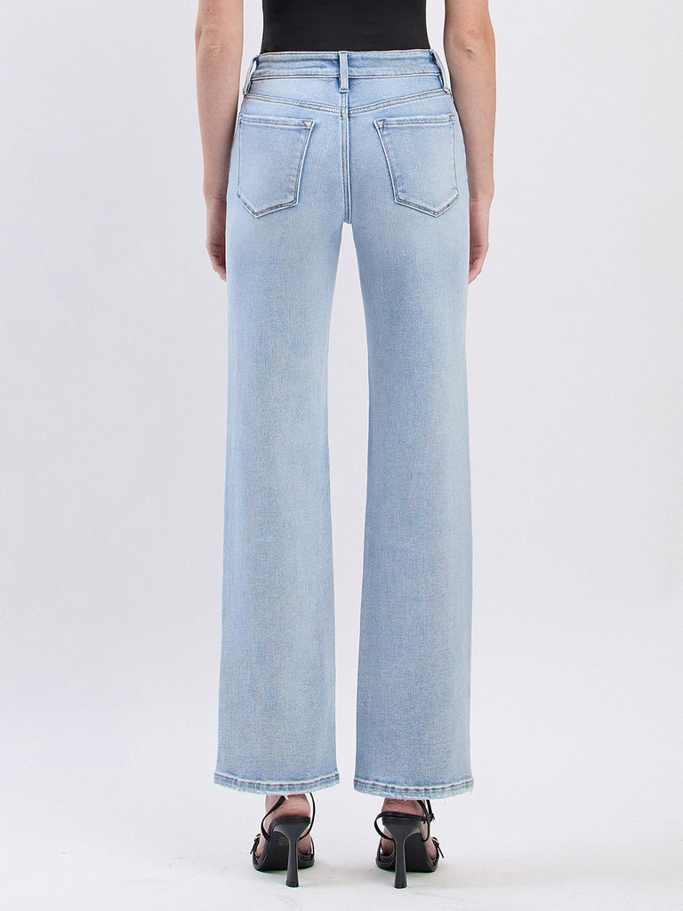 Light blue jeans worn by a person on a white background