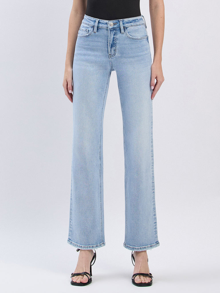 Light blue jeans worn by a person on a white background