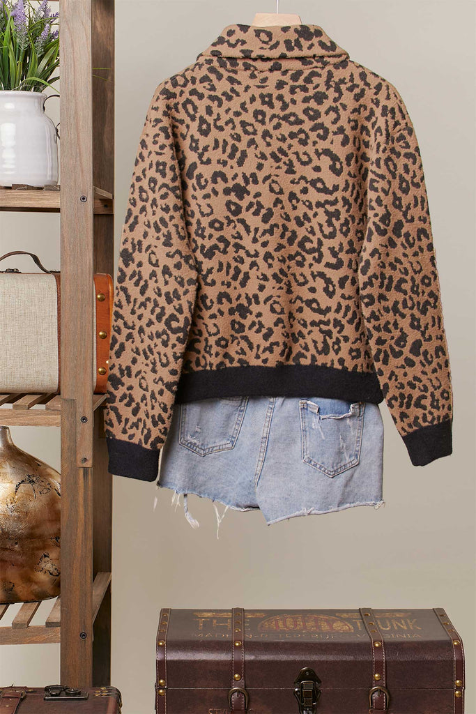 Brown leopard knit zip-up jacket with oversized denim patch pockets and ribbed trim.