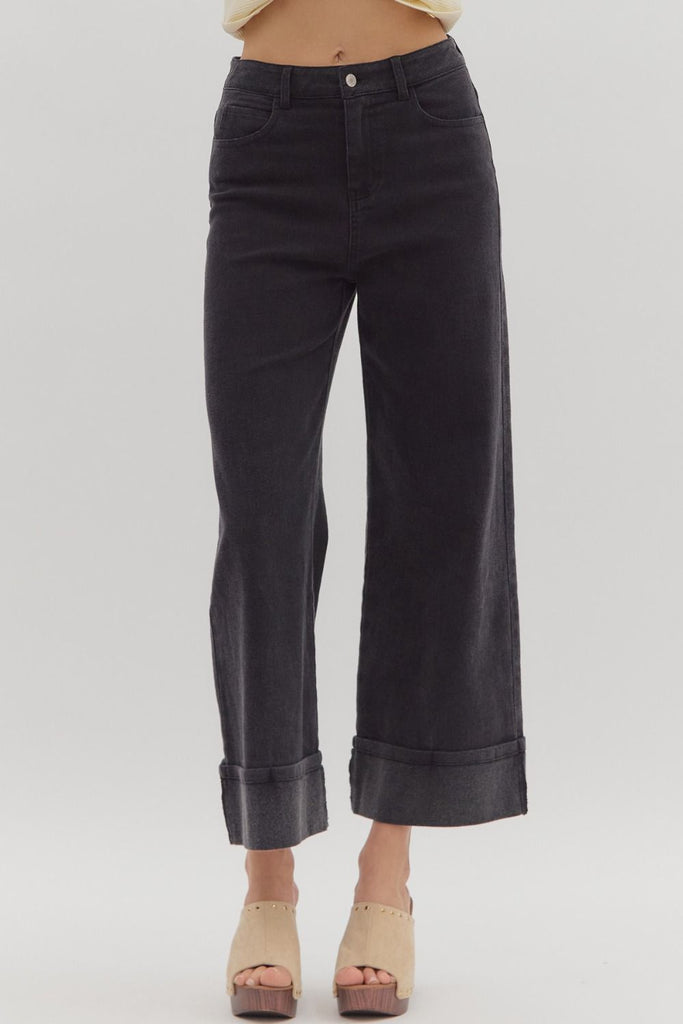 The Lexie pants offer a modern twist on classic denim. With a sleek mid-rise fit and ankle-grazing length, this pair is finished with extra-wide cuffed hems that bring a bold, fashion-forward feel. A touch of stretch adds comfort, while the deep black wash keeps things effortlessly cool and versatile.