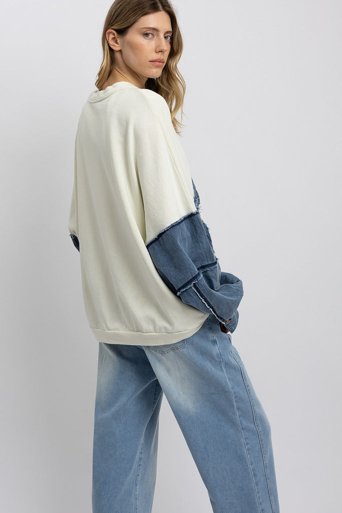 Marceline Denim Bow Contrast Sweatshirt featuring oversized fit, frayed denim bows, and soft mineral-washed French terry fabric.