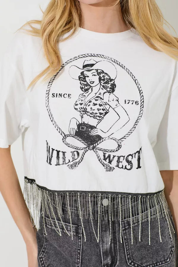 White t-shirt with 'Wild West' graphic design worn by a person.