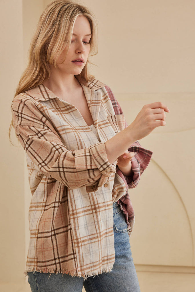 Oversized multi-plaid shacket in beige, cream, and blush with raw-edge hem and chest pocket.
