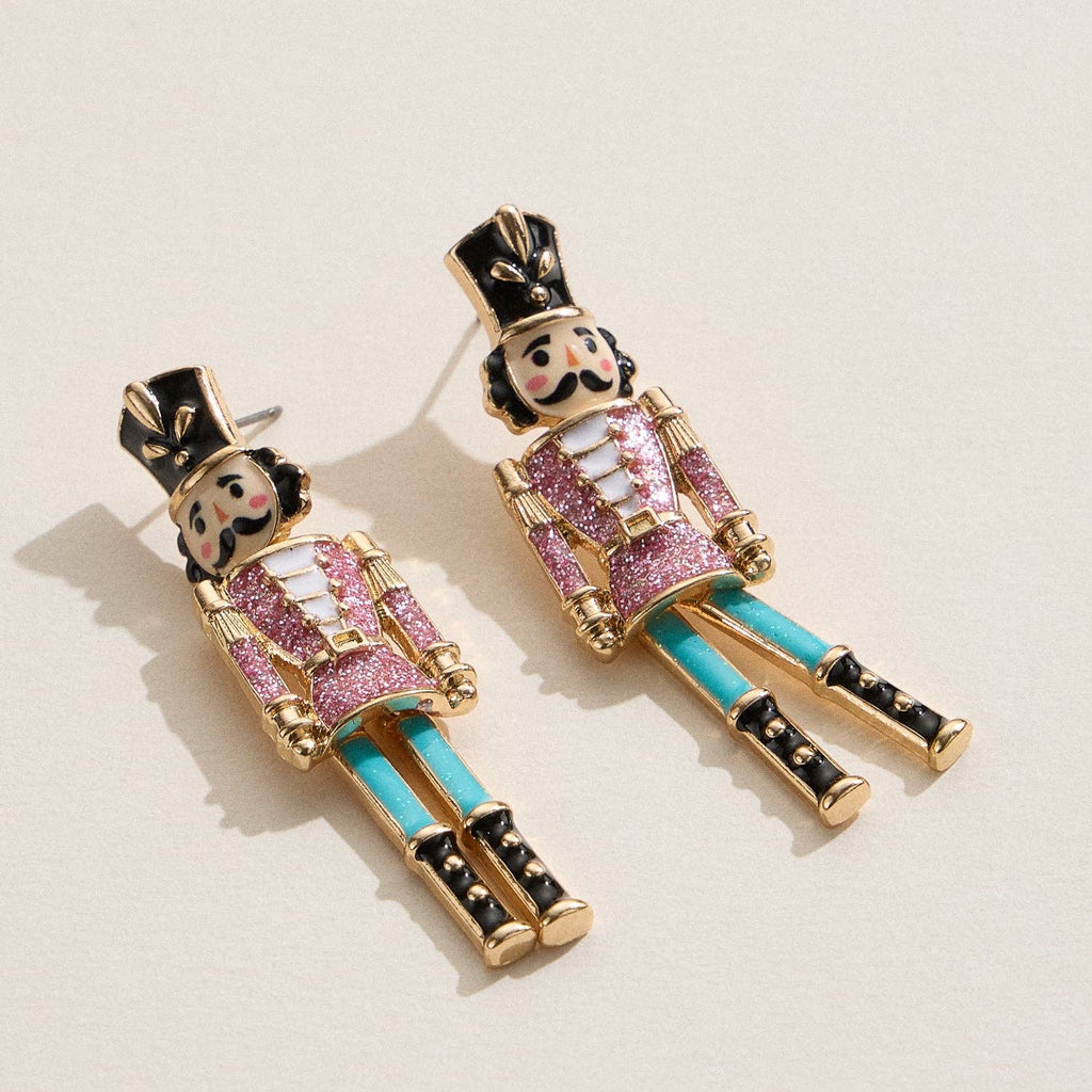 Colorful nutcracker enamel earrings with glitter accents and titanium posts.