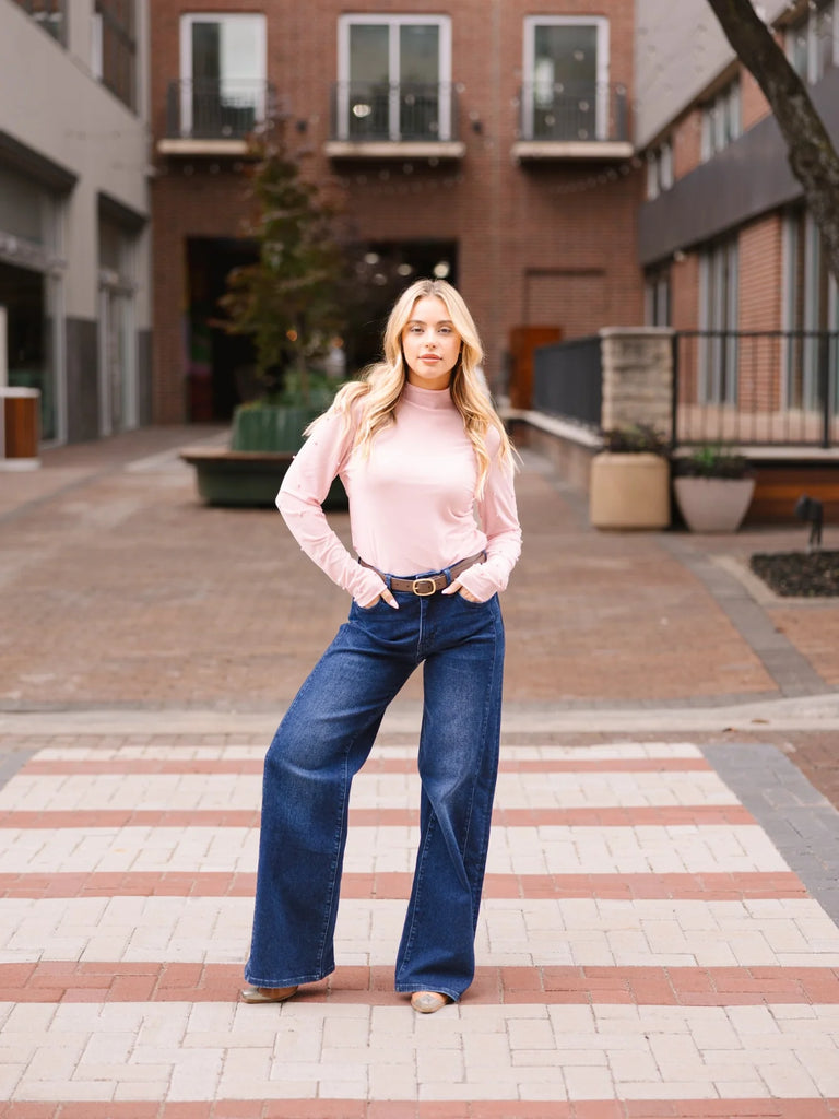 Everleigh pink mesh mock neck top with delicate pearl bead embellishments, a fitted silhouette, and long sleeves, styled with a camisole underneath
