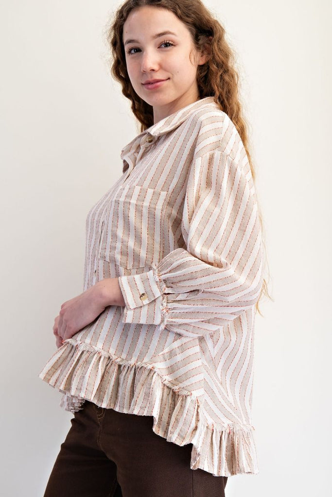 A mushroom-colored linen shirt with vertical white and red stripes. It has a collar, button-down front, long sleeves, and a ruffled hem.
