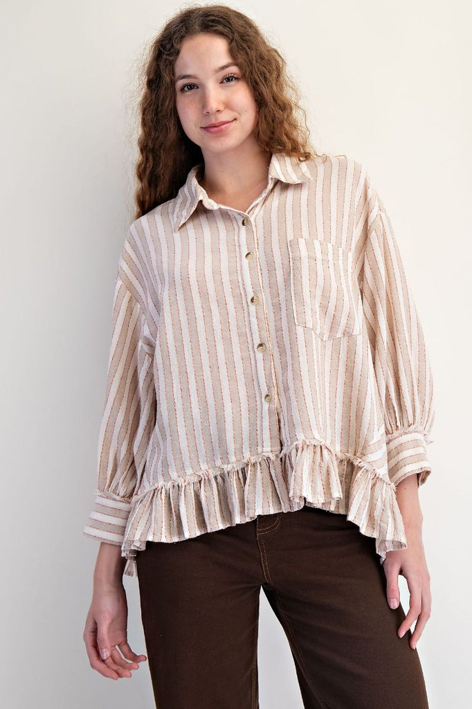 A mushroom-colored linen shirt with vertical white and red stripes. It has a collar, button-down front, long sleeves, and a ruffled hem.