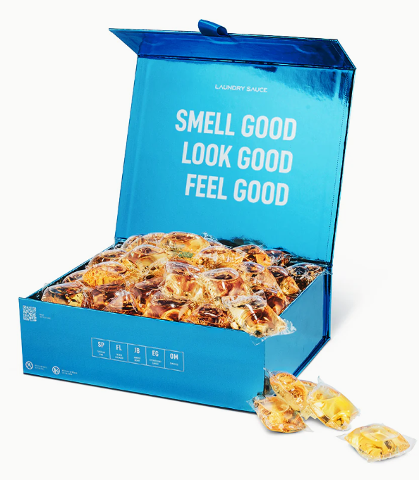 Blue box of popcorn with text 'Smell Good, Look Good, Feel Good' on a white background