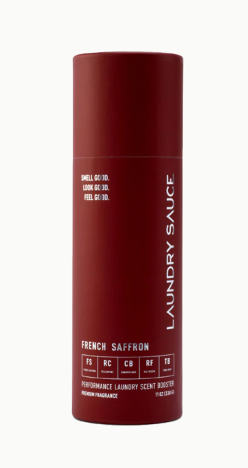 Red cylindrical container labeled 'Laundry Sauce' with text on a white background