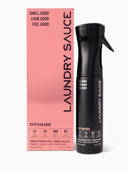 Black laundry sauce spray bottle with pink packaging labeled 'Laundry Sauce' on a white background.
