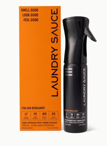 Black laundry spray bottle with orange box labeled 'Laundry Sauce' on a white background