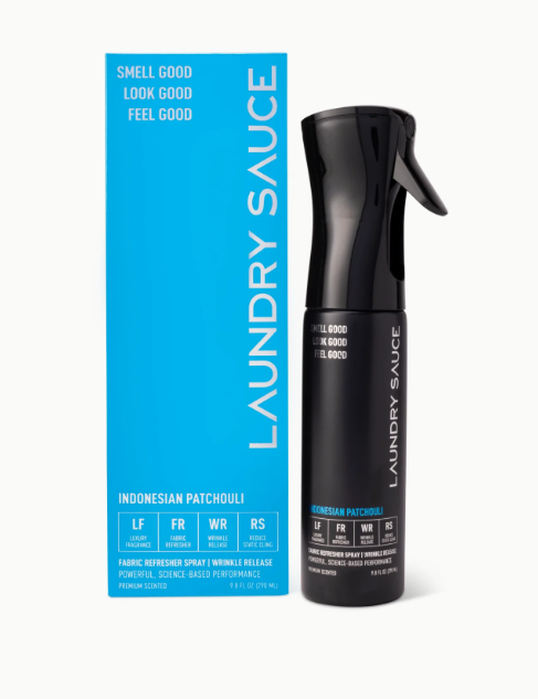 Black spray bottle labeled 'Laundry Sauce' next to its packaging on a white background