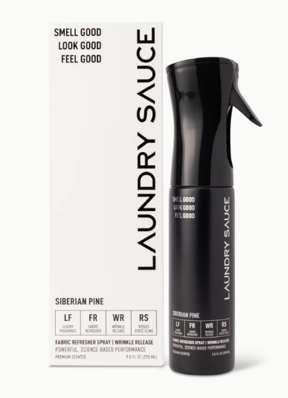 Black laundry sauce spray bottle with packaging on a white background