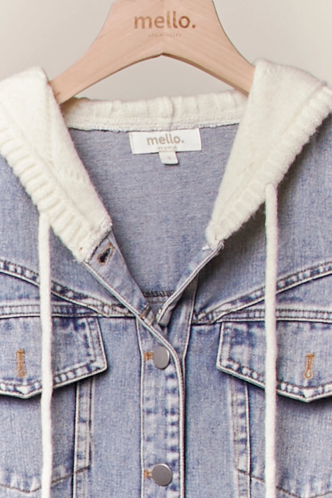 Seraphina knit sleeve denim jacket from Mello, featuring a light wash denim body with an attached knit hood and cream-colored cable-knit sleeves