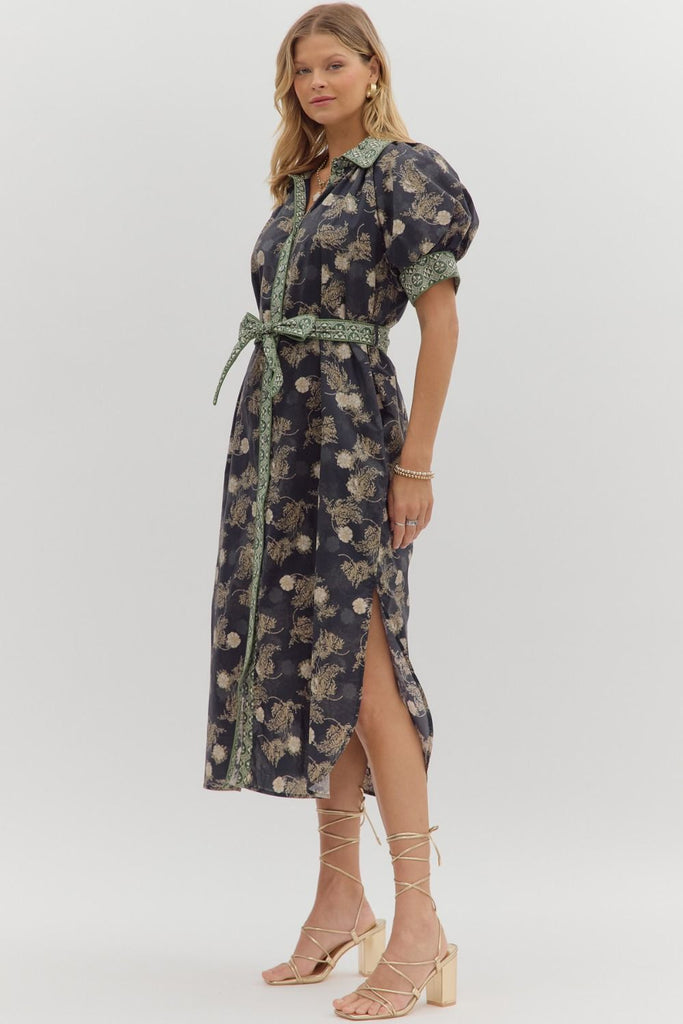 Navy floral midi shirt dress with short puff sleeves, front button closure, removable belt, contrast collar, and side pockets