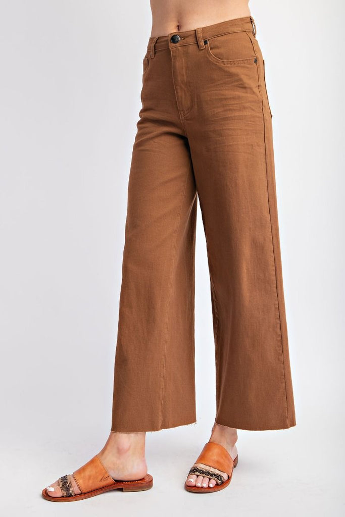 A pair of coffee-colored, high-waisted, wide-leg twill pants with a soft stretch.