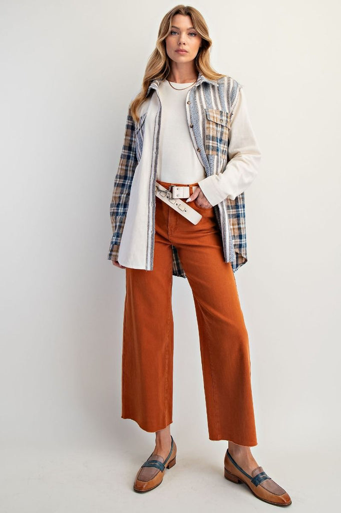 A pair of brick-colored, high-waisted, wide-leg twill pants with a soft stretch.