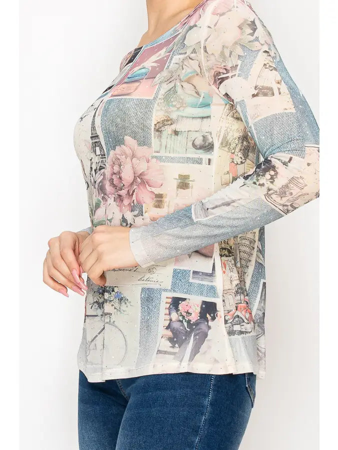 "Women’s sparkly sheer mesh long sleeve top with Paris-inspired collage print, soft pastel tones, floral accents, and subtle shimmer — boutique romantic layering blouse"