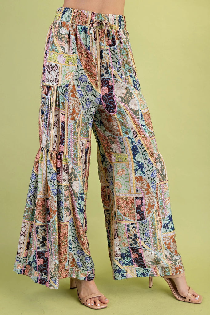 Colorful patchwork pants on a green background