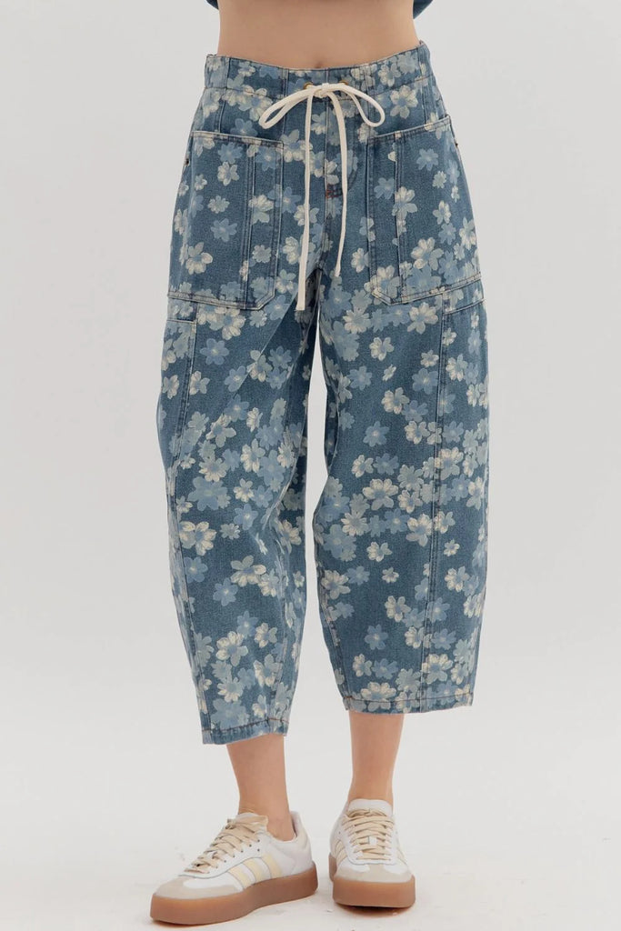 floral print, mid-rise, ankle-length balloon pant designed for a laid-back yet stylish vibe. Featuring an elastic back waistband with a front adjustable drawstring, plus front and back patch pockets for added function and flair.