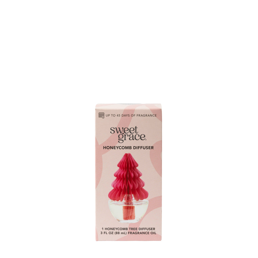 Pink honeycomb Christmas tree diffuser in clear glass base with Sweet Grace packaging.