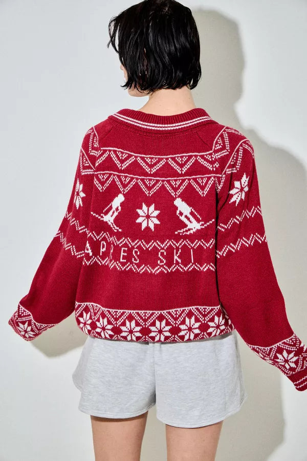 Viatrix red ski Fair Isle zip-up cardigan with white snowflake and skier motifs, featuring a wide collar and a relaxed fit.