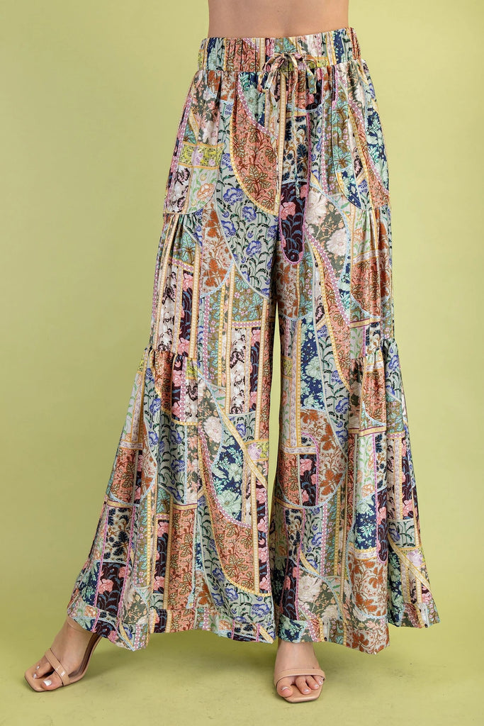 Multicolored patterned pants on a green background