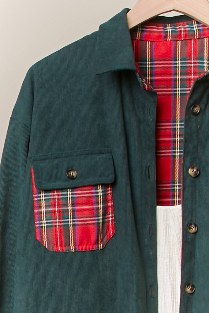 Reversible shacket with red plaid on one side and green corduroy with plaid pockets on the other.