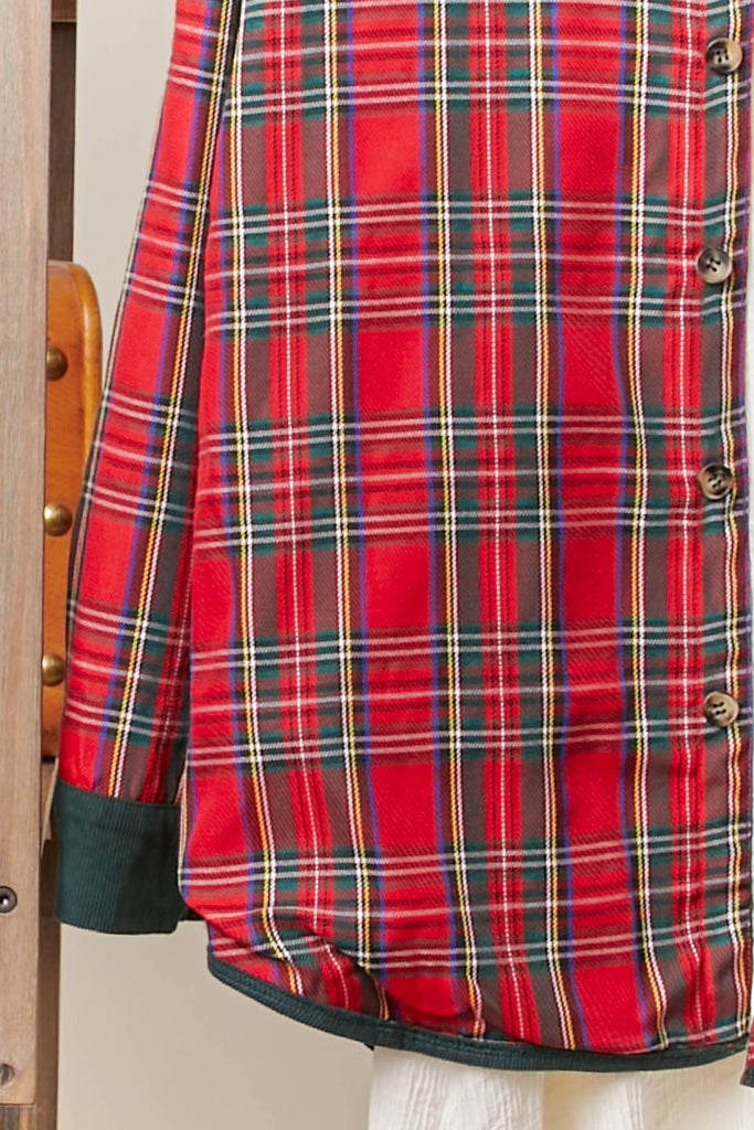 Reversible shacket with red plaid on one side and green corduroy with plaid pockets on the other.