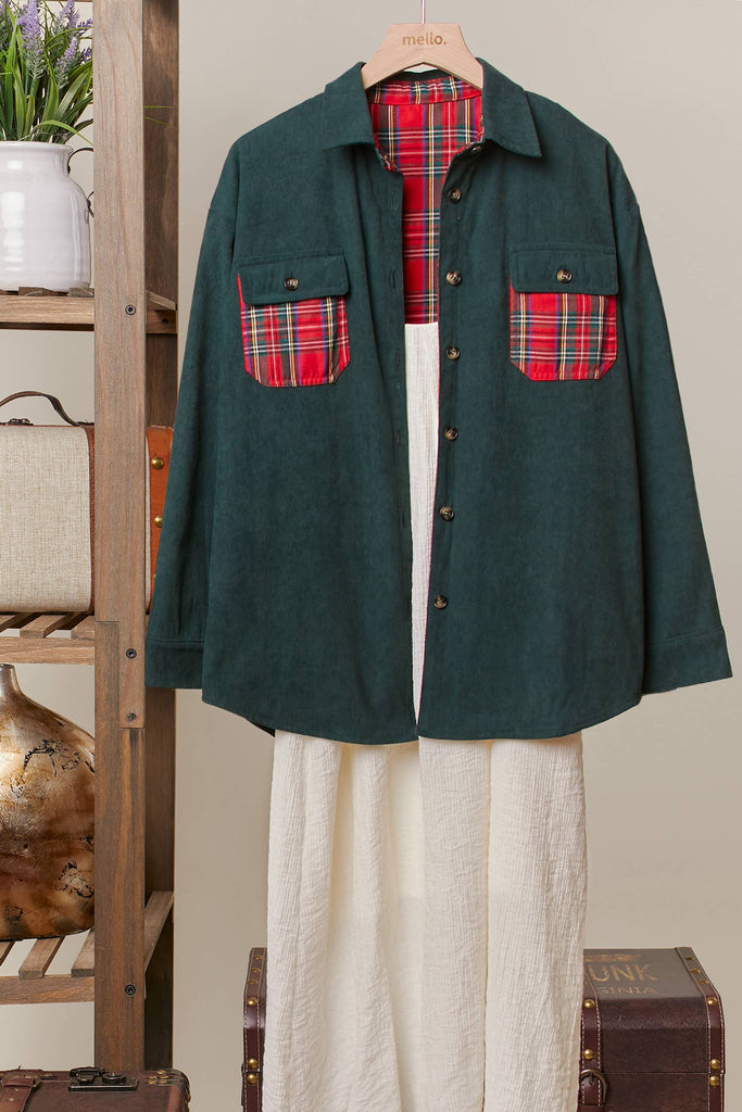 Reversible shacket with red plaid on one side and green corduroy with plaid pockets on the other.