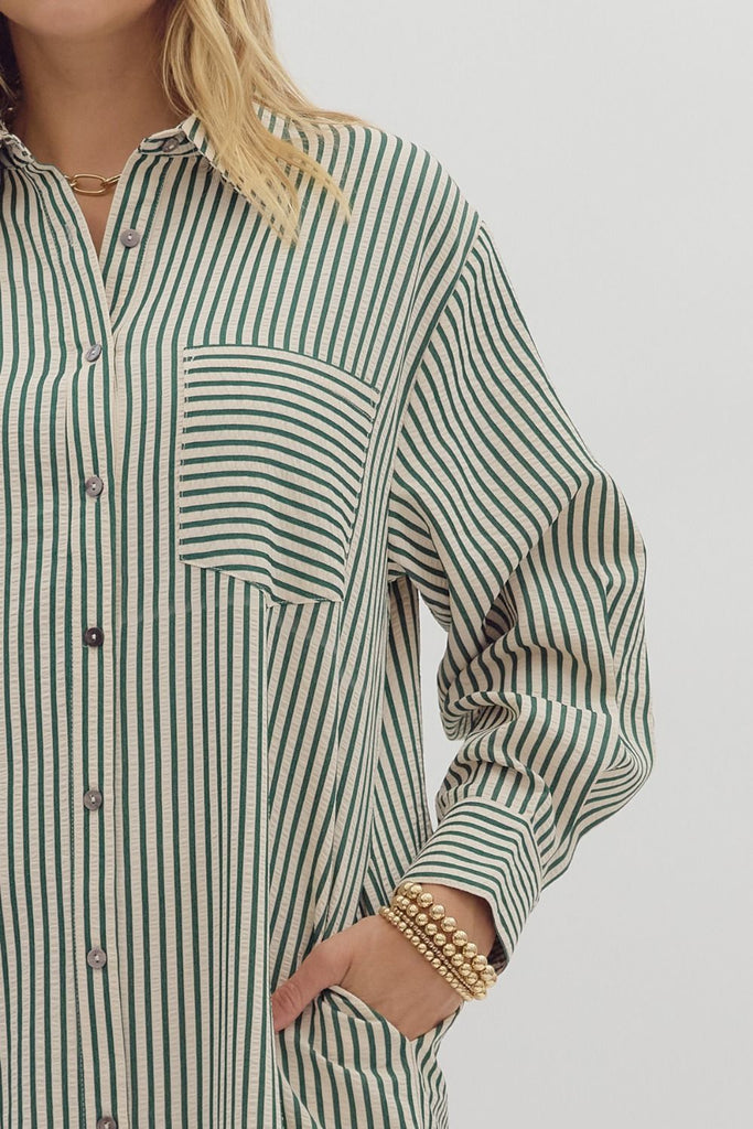 Hunter green textured stripe midi shirt dress with long sleeves, button front, side pockets, and rounded slit hem