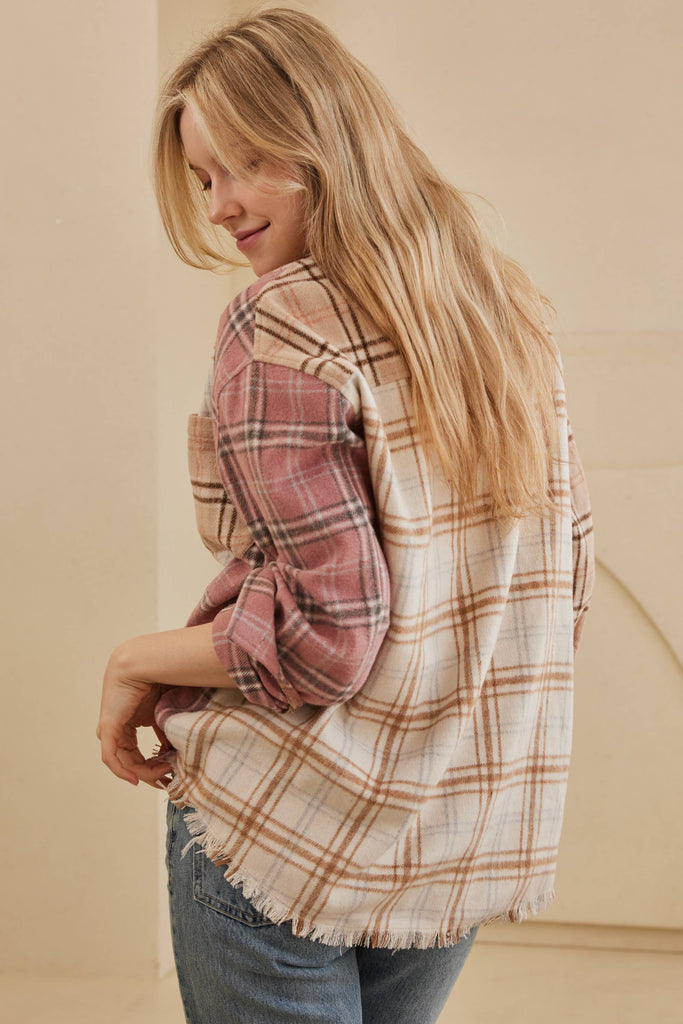 Oversized multi-plaid shacket in beige, cream, and blush with raw-edge hem and chest pocket.