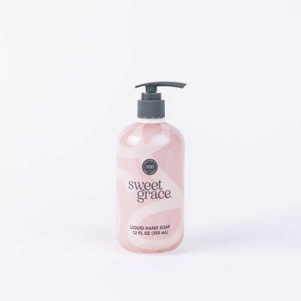 Pink bottle of sweet grace liquid hand soap on a white background