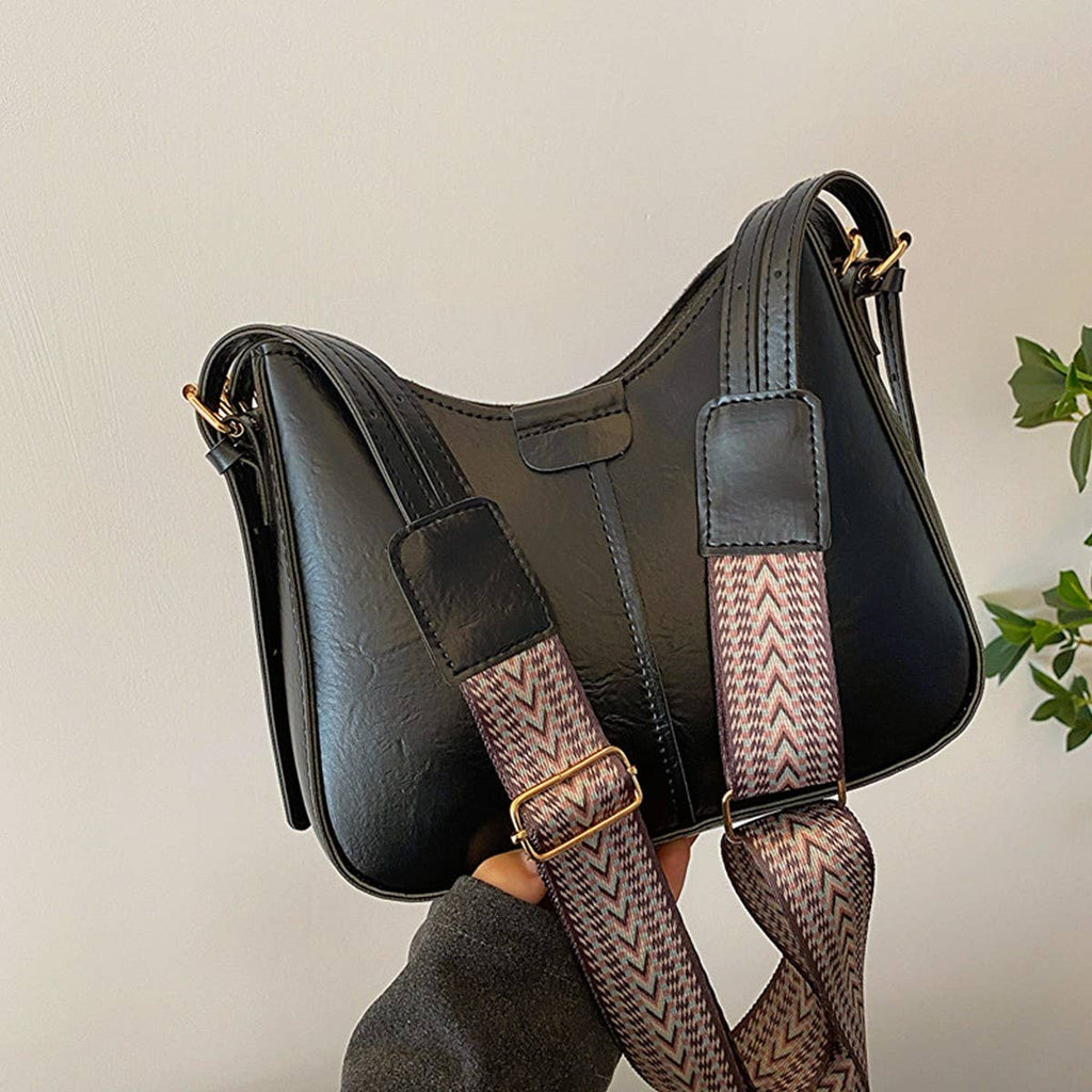 “Black retro commuter crossbody bag with gold hardware and adjustable patterned strap, boutique women’s PU leather purse available in black and brown.”