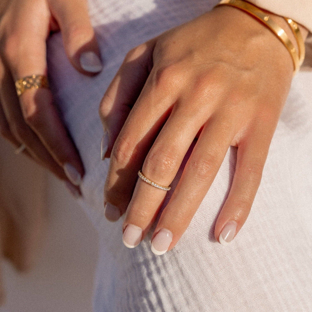 Close up of hands with several rings