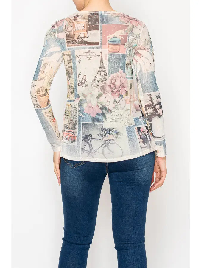 "Women’s sparkly sheer mesh long sleeve top with Paris-inspired collage print, soft pastel tones, floral accents, and subtle shimmer — boutique romantic layering blouse"
