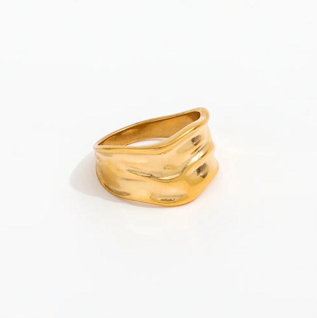 Gold ring on a white background