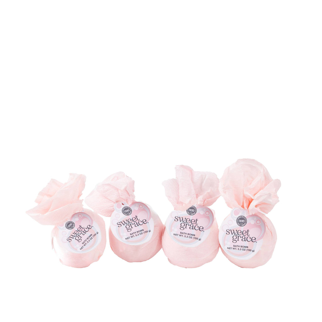 Four pink bath bombs with 'sweet grace' labels on a white background