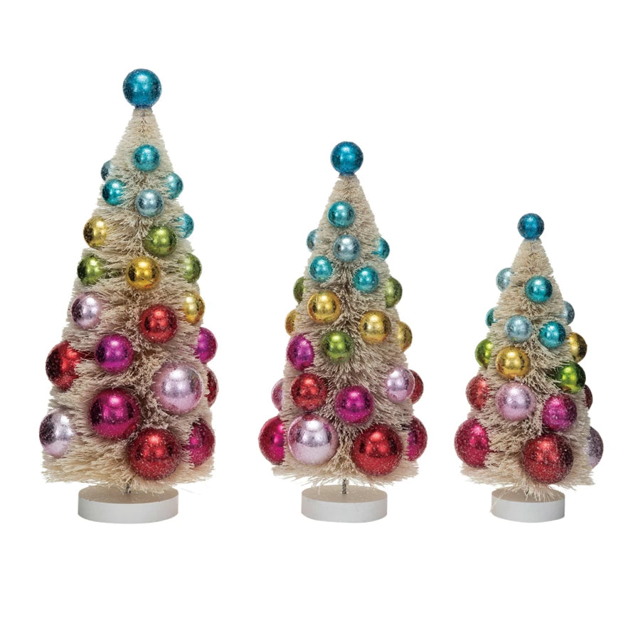 Single sisal bottle brush Christmas tree with colorful ornaments and wood base, festive tabletop holiday decoration.