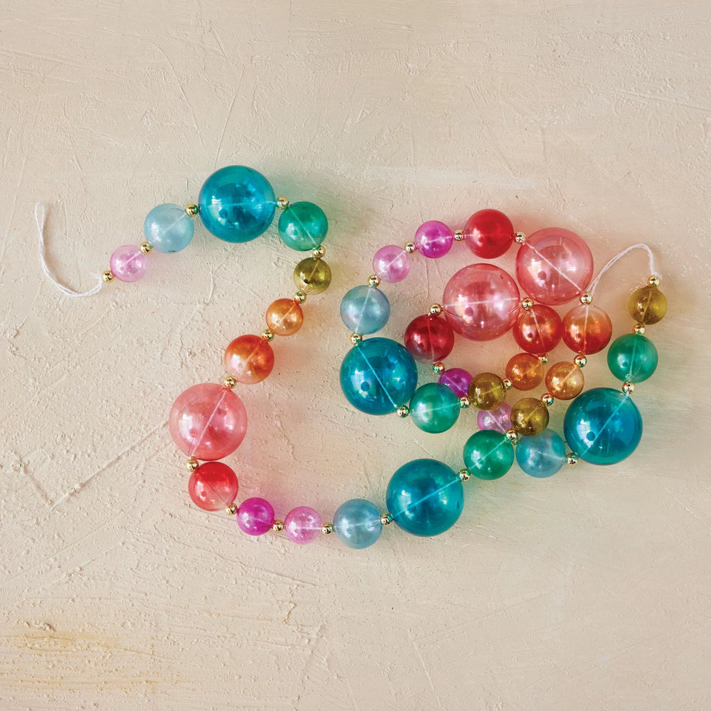 72-inch multi-color plastic ball garland with shiny beads in assorted rainbow colors, displayed in a loop.