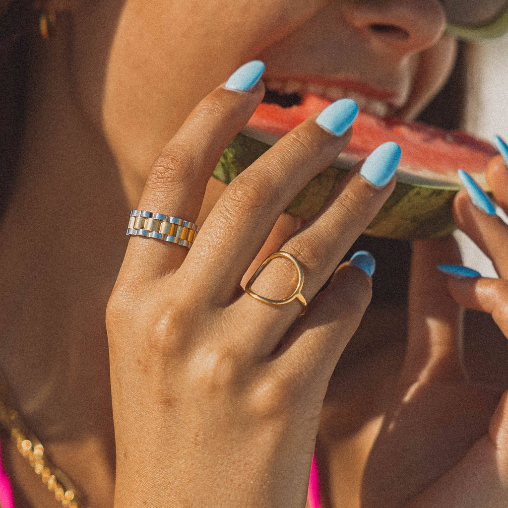 rings on fingers eating watermelon
