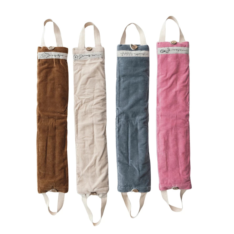 Four neck wraps s in brown, beige, blue, and pink with straps on a white background.