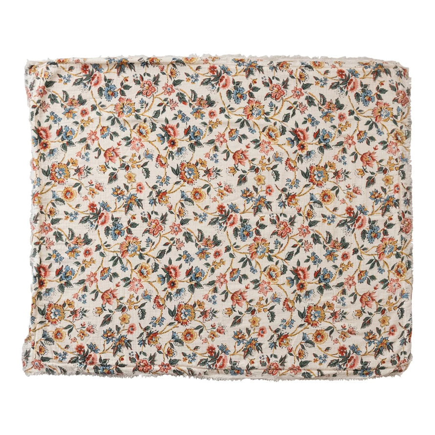 Floral patterned blanket on a white background
