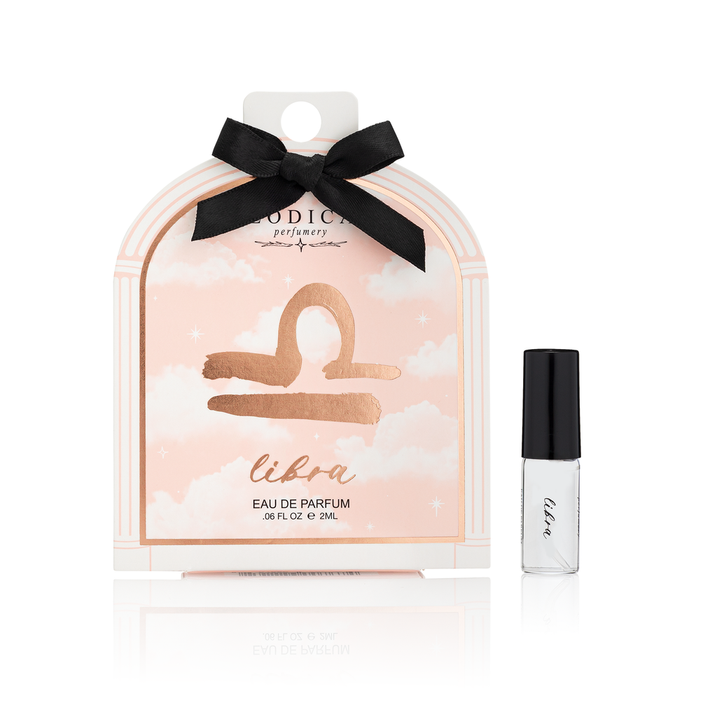 Libra Eau de Parfum packaging with a black bow and a small bottle on a white background