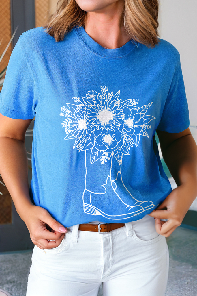 blue graphic tee with boot and flower outline