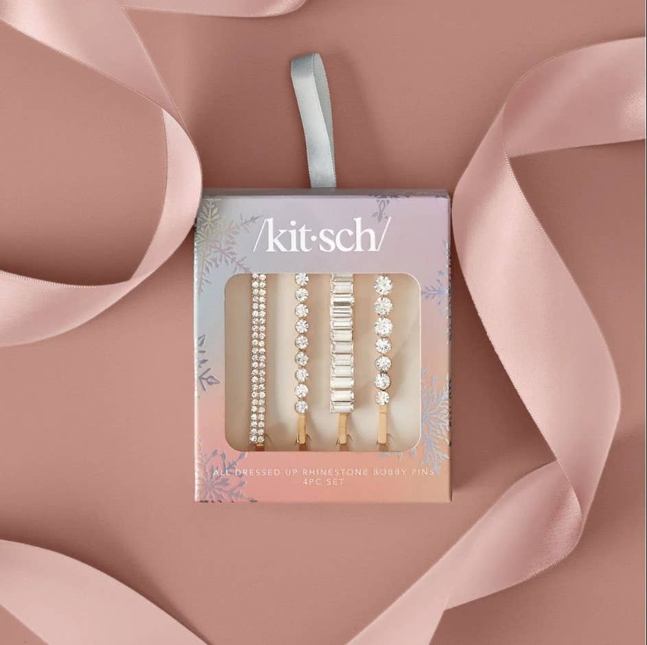 Kitsch hairpin set packaging with ribbons on a pink background