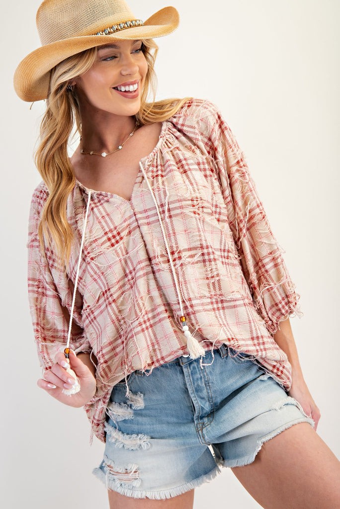 Distressed plaid blouse with ¾ sleeves, ruched neckline, and beaded tassel ties in a relaxed country fit. women's boutique easel