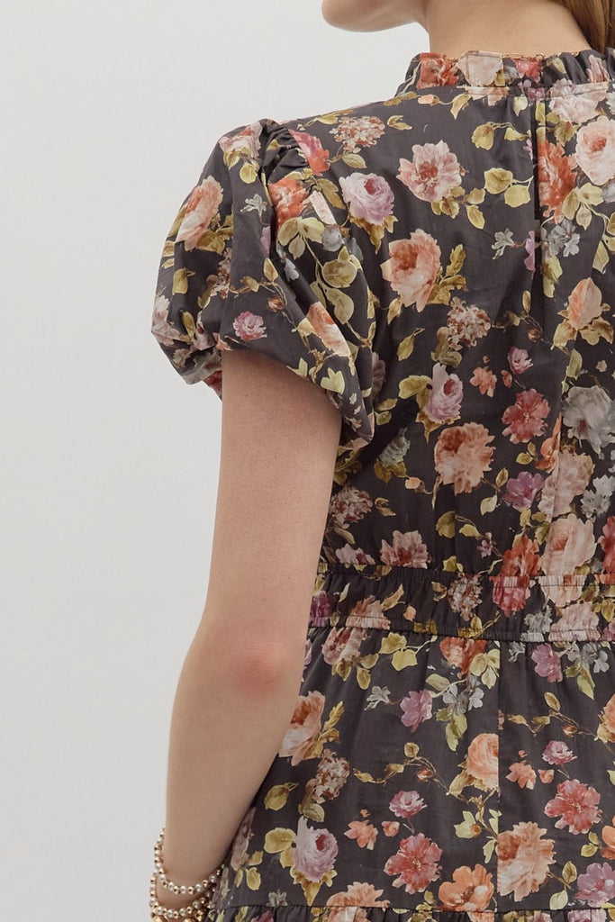 Floral dress with puff sleeves on a plain background