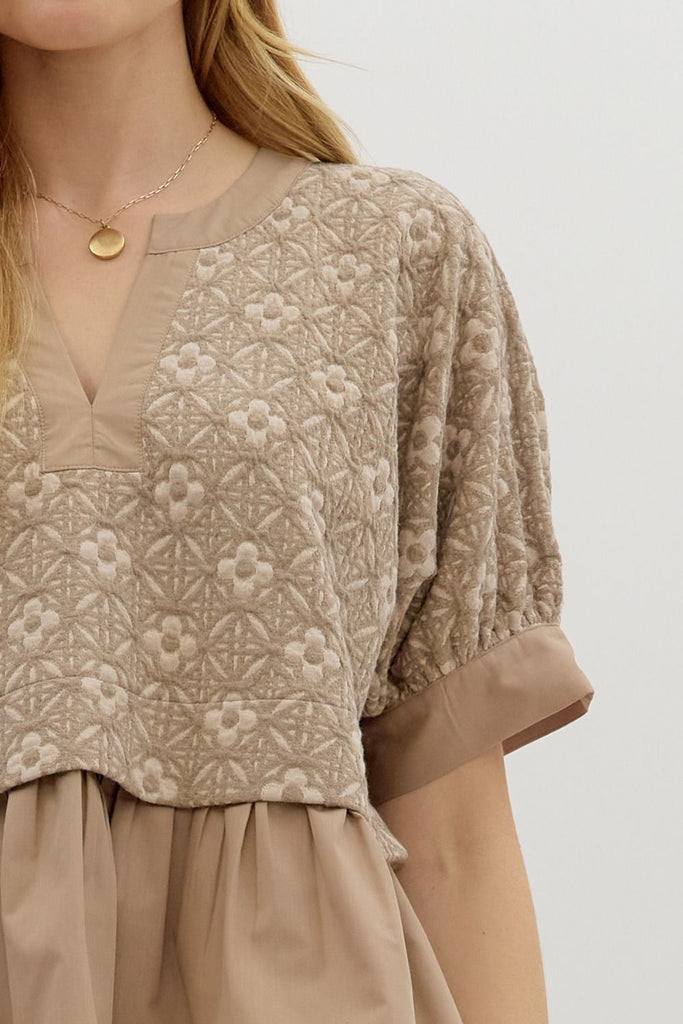 Mocha floral jacquard short sleeve pullover top with contrast ruffle hem and lightweight knit fabric, boutique women's blouse for summer fashion front closeup