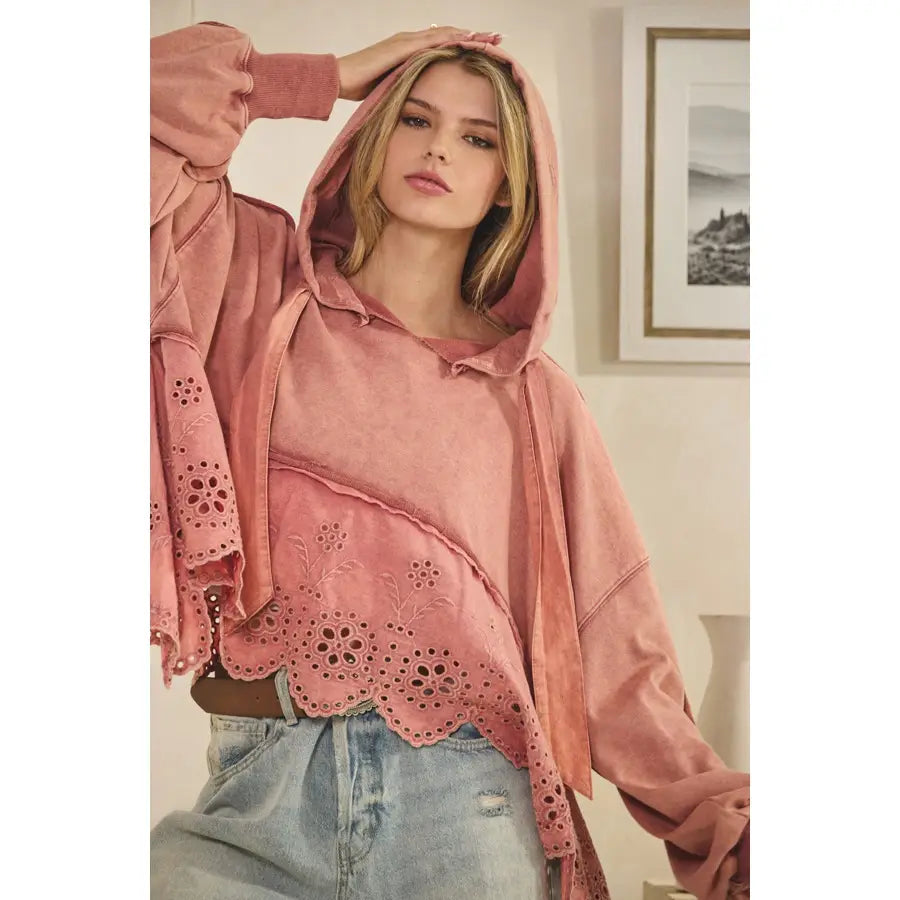 Hooded Mineral washed free people inspired boho sweatshirt with soft terry fabric and eyelet contrast details, relaxed fit, modeled with casual denim.